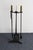 Vintage four-piece wrought iron fireplace tool set with asymmetrical brass 'fin' handles designed by Donald Deskey for the...