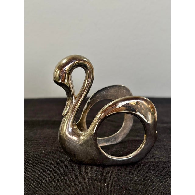 Darling set of four silver swan napkin rings. Lovely luster, excellent design.