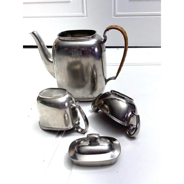This is a 3 pieces tea set made of Danish Pewter by Just Andersen. All 3 pieces are marked at the bottom. There’s a...