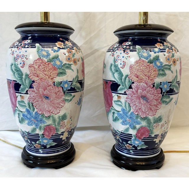A pretty pair of ceramic table lamps from the 1980's-90's. The ceramic vases are painted in a Shabby Chic floral style...