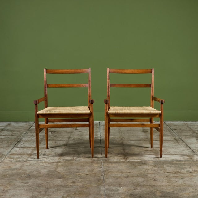Stunning and rare walnut armchair by Gio Ponti for Knoll International, c.1960s, Italy, is an exquisite example of mid-...