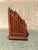 This a beautiful wood letter holder in the form of picket fence. It has brass finials at the four corners and there are...