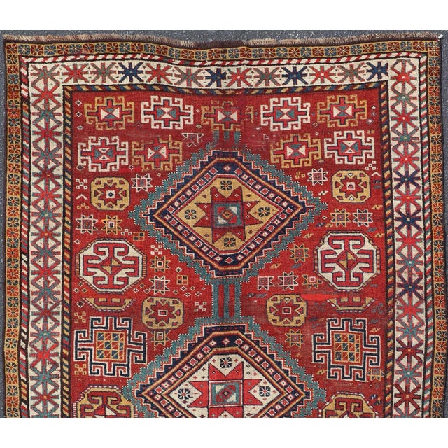 Keivan Woven Arts - Unique Antique Qashqai Rug with Geometric Motifs in Red, Blue, and Golden Yellow, Rug # This stunning...