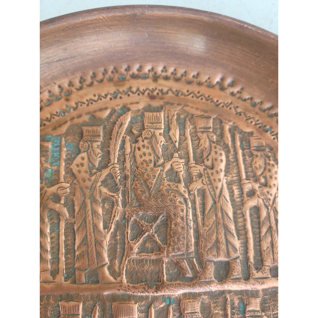 This striking vintage hand-worked copper wall charger features an elaborate repoussé and chased scene inspired by the...