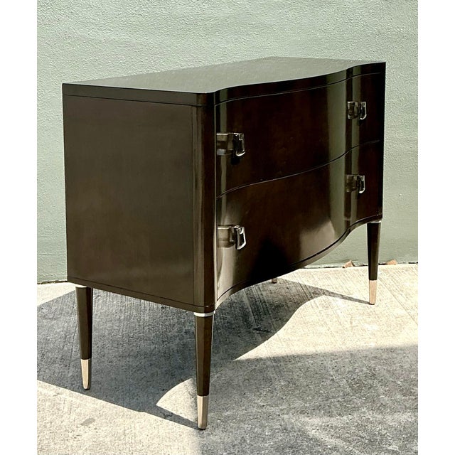 This sophisticated Vanguard Furniture commode seamlessly blends Art Deco-inspired glamour with contemporary refinement....