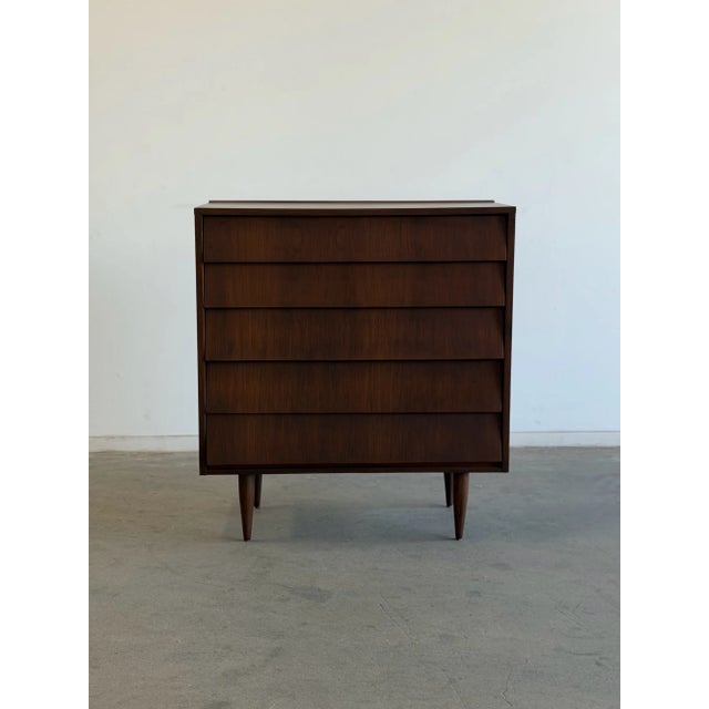 W40 D18 H44.25 Fully refinished walnut Louvered Highboy. A classic mid century piece. Added new rails to allow a seamless...