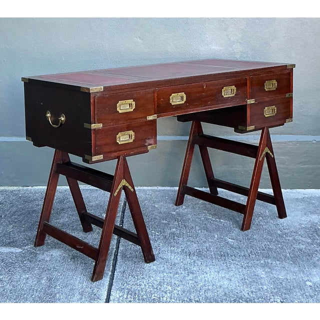 This distinguished vintage campaign desk by the esteemed maker Jans of London is a masterclass in classic British...