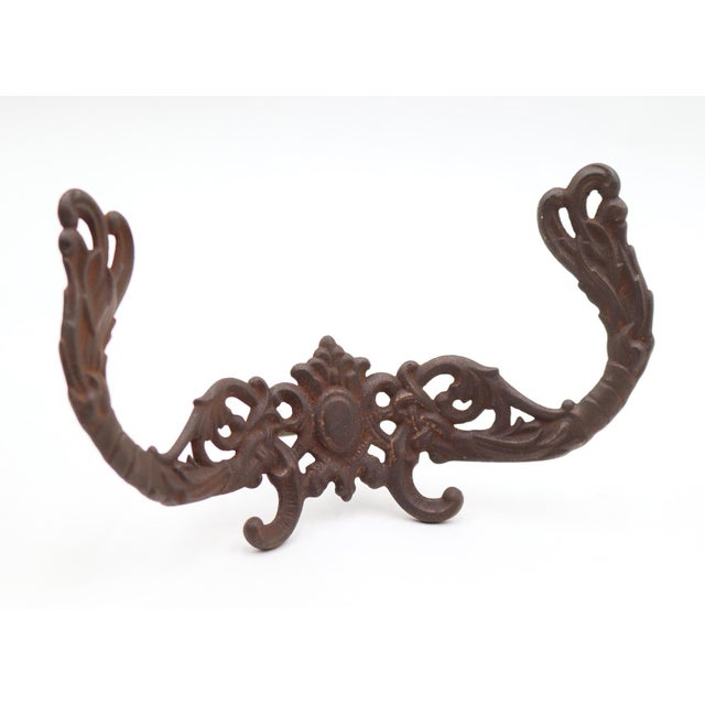 Antique Victorian style hall tree hook made of cast iron. The original mounting nut is not included. Good condition with...