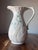Belleek Pottery Pitcher Daisy Pattern Made in Ireland Description: Embossed Daisies, Green Shamrocks 9" height 48 oz No...