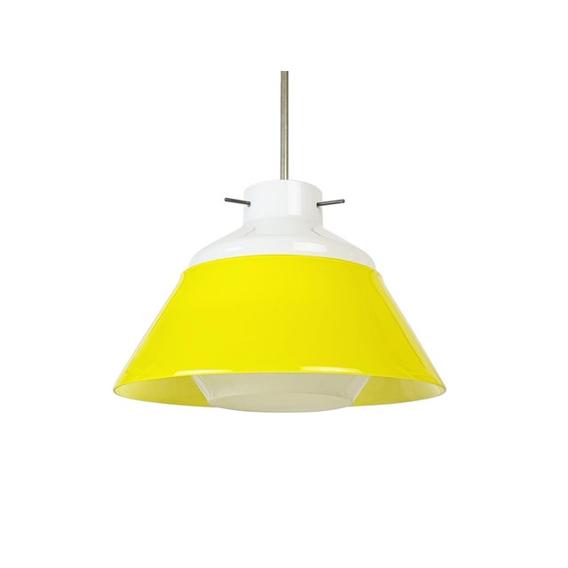 Pendant lamp produced around the 1950s in Italy. The lampshade is made of two glass caps, a white one connected to the...