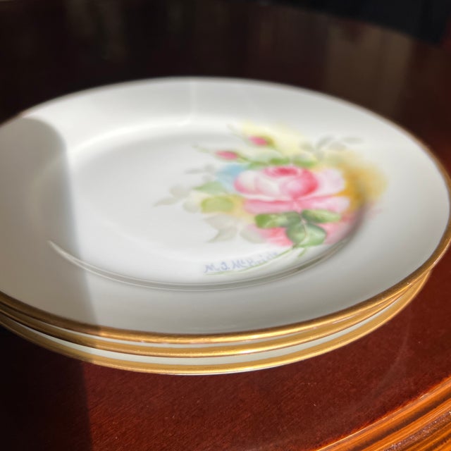 Vintage set of four hand painted plates Each plate features hand painted roses in delicate hues of pink and green. Rims...
