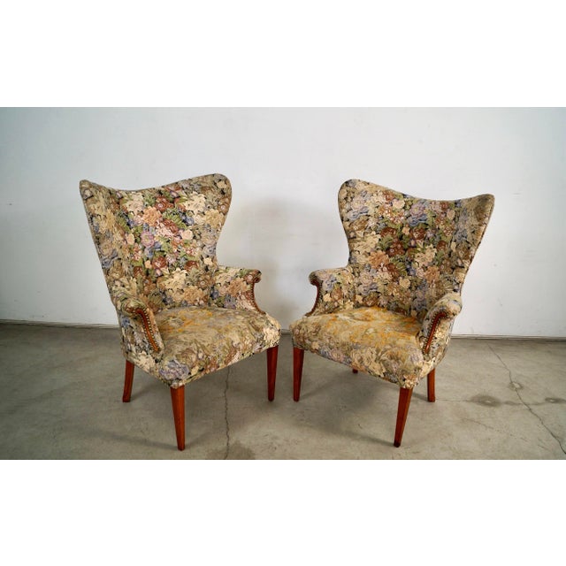 Pair of 1940's Mid century wing armchairs for sale. They have a beautiful butterfly wingback, and are structurally solid...