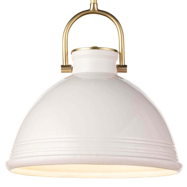 Classic lines and carved horizontal detailing make the ceramic Eloise pendant a clean and bright statement for a kitchen...