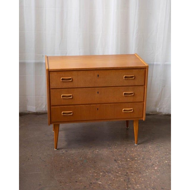 A compact Swedish teak chest of drawers from the 1960s — well-proportioned, quietly refined, and more versatile than its...