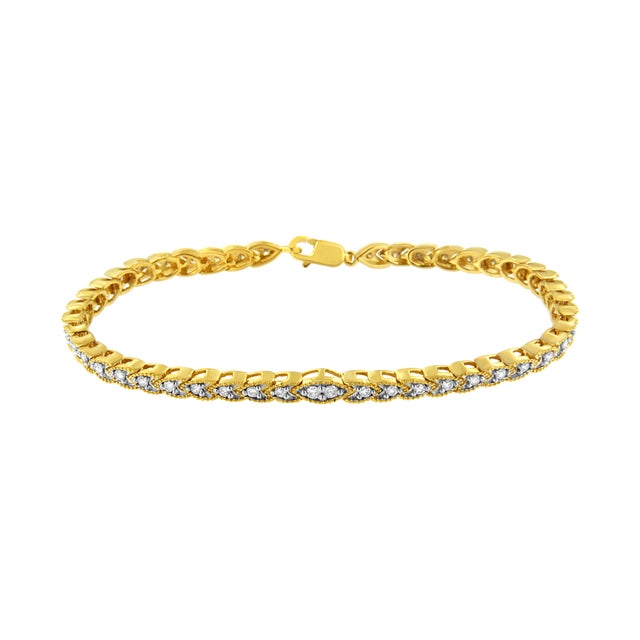 Embellish your wrist with this beautiful 10k yellow gold plated sterling silver link bracelet. At the center of the...