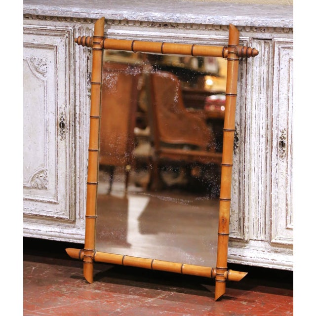 Decorate a powder room, hallway, bedroom, or living room with this elegant antique faux bamboo wall mirror. Crafted in...