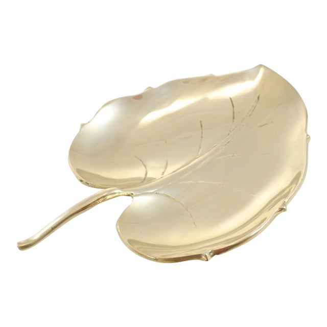 Large vintage solid cast brass leaf with engraved veins and a stem handle. Use as an entryway catchall dish or coffee...
