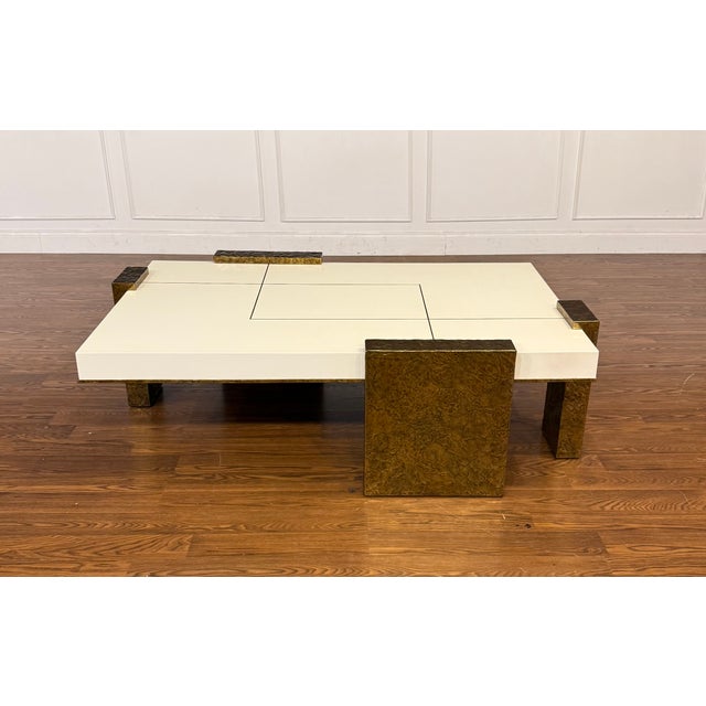 This is the Kyra Contemporary Cocktail Table by Century Furniture. Its modern design features a white lacquered top with...