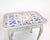 The rococo tile table, painted gray and dated 1780, is a charming example of classic furniture design. Its elegantly...