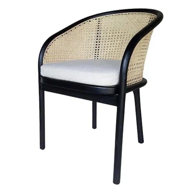 The Camille Dining Chair in black offers a comfortable and stylish seating option for your dining room. The rounded wood...