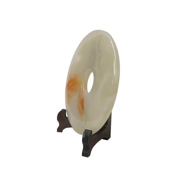 This round polished natural stone display is a unique and attractive accent piece for any home. The stone is polished to a...