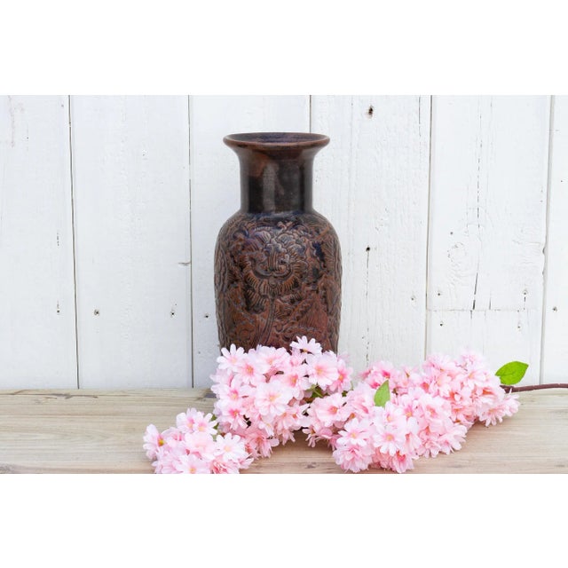 Large enchanting Thai ceramic jar with a beautiful glazed brown finish in two tones. This tall asian vase features a...