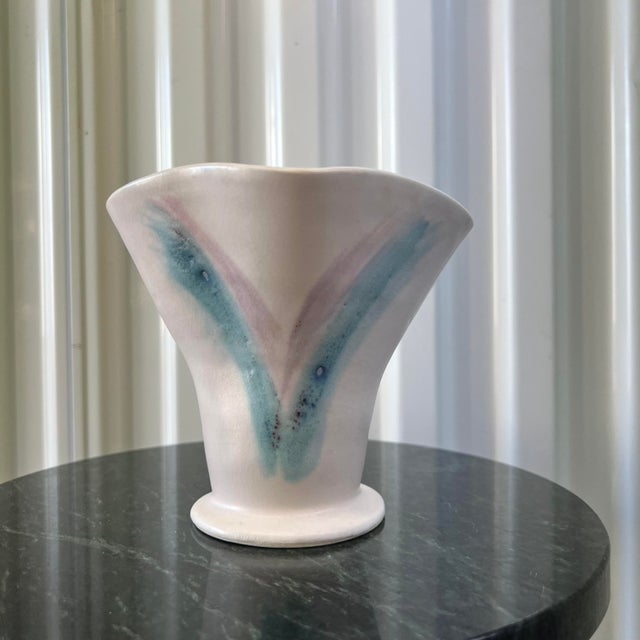 A fun 1980’s pink and blue abstract studio pottery vase. Signature on bottom is illegible.