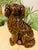 Antique 19th century Bennington pottery of a seated spaniel with treacle glaze. From the Bennington factory in Vermont....