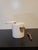 Solid marble salt cellar in a cylindar design with wooden spoon and rest. Made by William Sonoma.