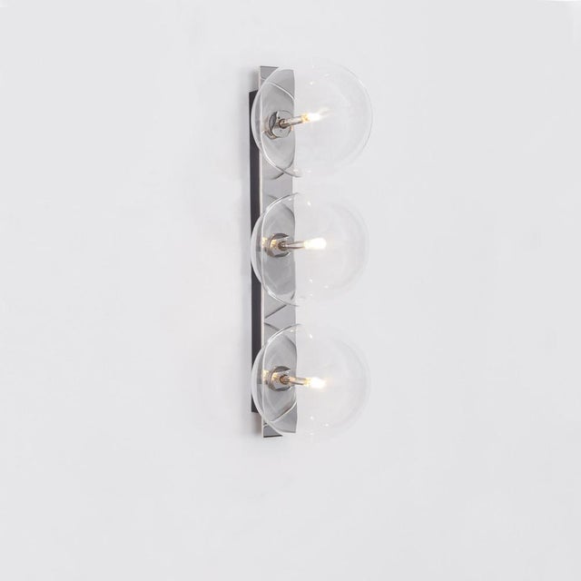 Oslo triple wall sconce by schwung dimensions: w 15 x d 19 x h 50 cm materials: polished nickel, hand blown glass globes...