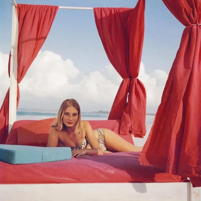 Tania Mallet 1961: Actress Tania Mallet relaxes on a red-curtained four poster in Eleuthera, in the Bahamas. She is best...