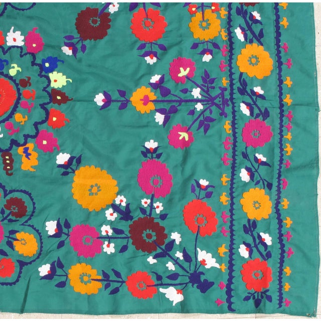 Finely woven cotton-ground Vintage Suzani with hand-embroidery. Fine floral design. This Suzani embroidery has the most...