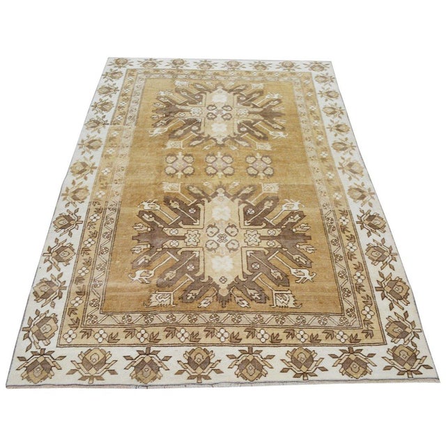 Hand-knotted with care using traditional rug-making techniques, this wool rug blends timeless craftsmanship with a modern...