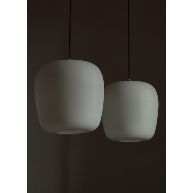 A sculptural and very rare pair of scandinavian modern “funkis” pendant lights by fog & mørup, designed and produced in...