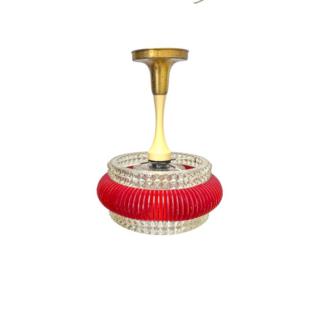 Vintage Space Age pendant lamp made of ribbed red plastic with a transparent plastic rim featuring a diamond pattern. In...