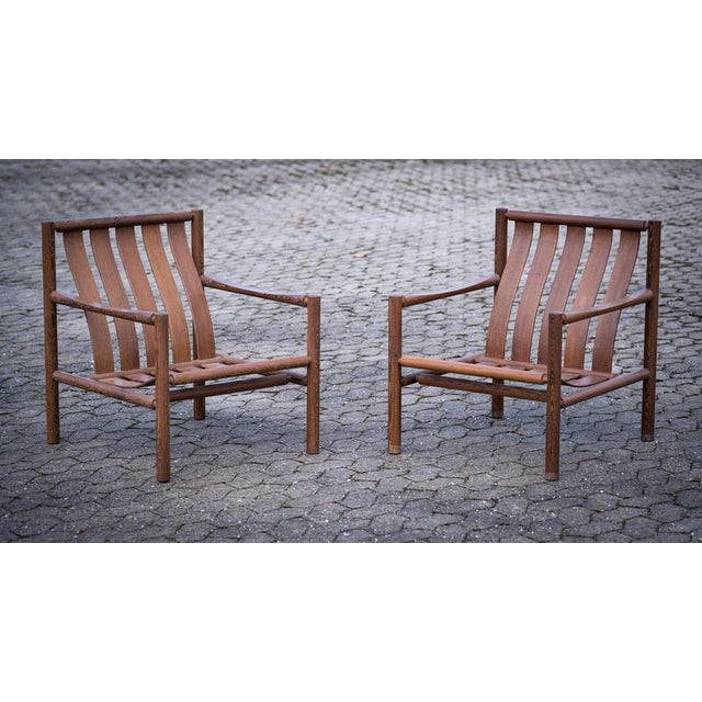 Pair of chairs designed by Jørn Nilson, first exhibited at the Snedkernes Autumn Exhibition in 1966. Crafted in rich wenge...