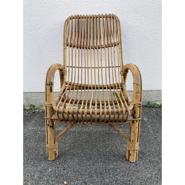 Rattan armchair Dimensions: H 93 x W 62 x D 85cm Seat height: 40cm