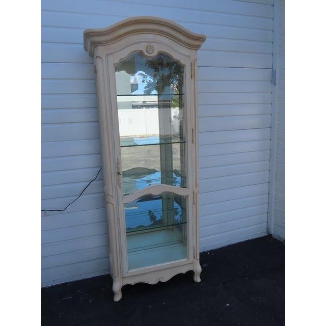 This China Cabinet is made of wood, solid wood, and glass. It was made by Ethan Allen, and it is labeled. The Cabinet has...