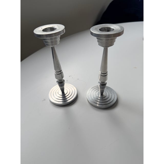 Beautiful deco looking candlesticks. They both come apart in 3 pieces. Very unique.