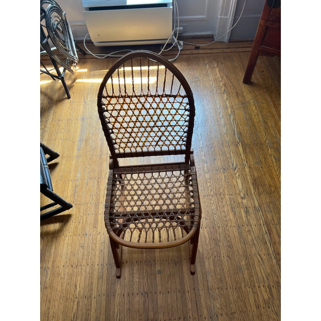 Fully collapsible rawhide and oak bentwood snowshoe chair, American made by Tubbs, Wellington, VT. This is a medium height...