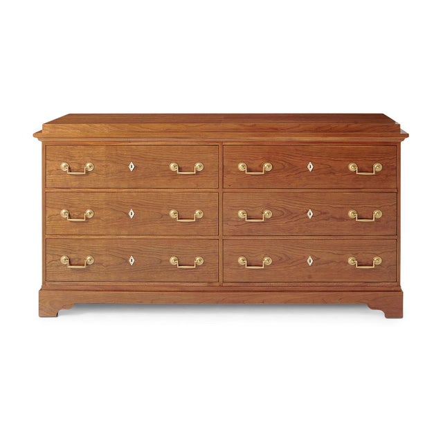 A Biedermeier dresser, architectural detailing shines in the six-drawer long dresser fitted with brass handles and ivory-...