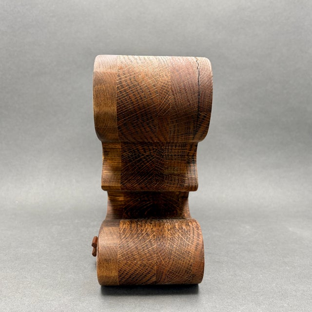This striking mid-century modern sculptural jewelry or keepsake box features a fluid, S-curve silhouette handcrafted from...