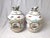 A pair of hand painted 19th Century KPM porcelain jars. The tops with eagle form finial sitting on a bulbous jar with...