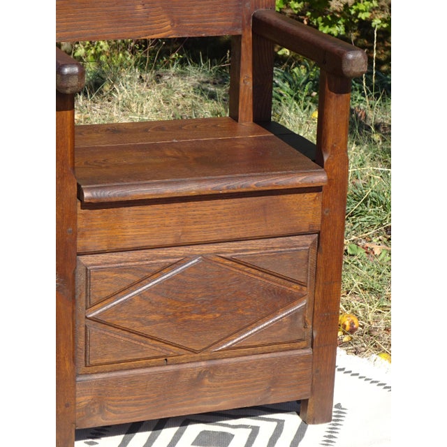 A charming armchair with a salt chest, crafted entirely from solid wood and fully pegged. The backrest is carved with a...