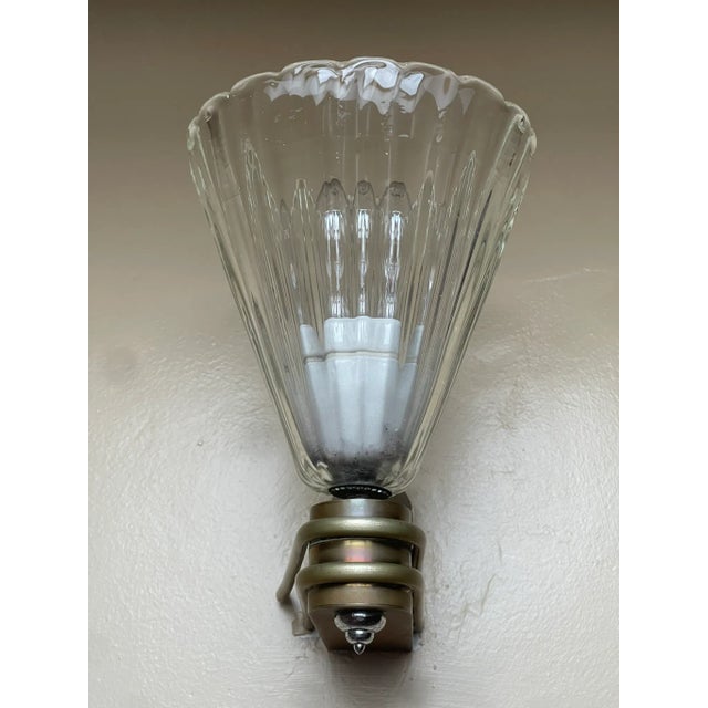 A rare and sculptural pair of Italian wall lamps, an ode to the modernist and industrial design of the 1920s and 1930s....