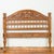 A carved vintage Indonesian headboard from the mid-20th century, with scrolling foliage and petite balusters. Crafted in...