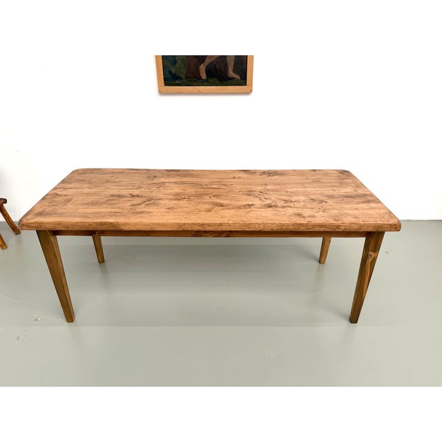 Superb farmhouse table, combining the authenticity of a thick, solid poplar top with the refined elegance of a tapered...
