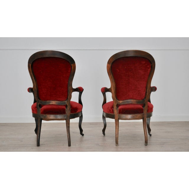 Chairs in walnut and velvet with wheels front legs.