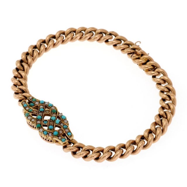 This beautiful Victorian Era bracelet is crafted from 15k rose gold featuring curb link chain with slide clasp. The center...