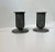 A pair of patinated candleholder in patinated pewter. Fluted design reminiscent of Corinthian Columns. In the style of...